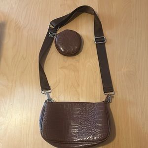 Brown adjustable shoulder/crossbody purse with additional circle pouch. Not worn